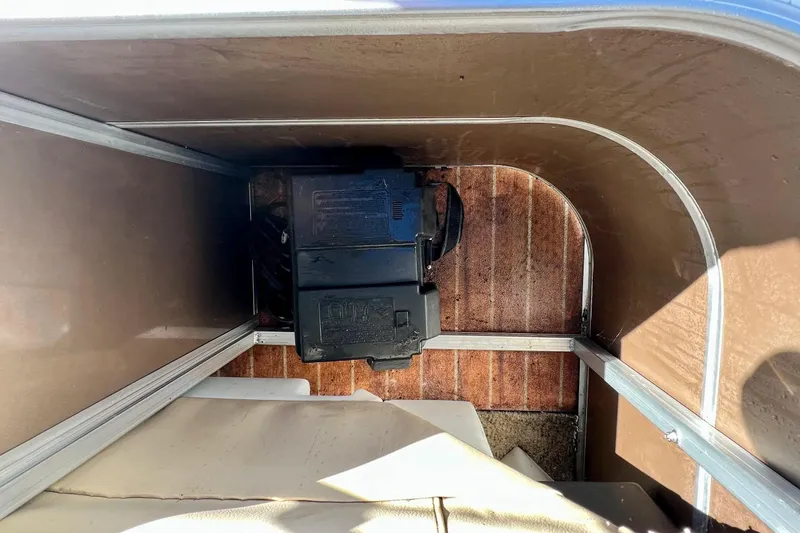 Slide: The Image of Red fuel tank inside a 2013 South Bay 417 CR boat compartment. - 32