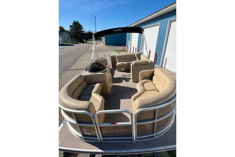 Slide: The Image of 2013 South Bay 417 CR pontoon boat with beige seating and open deck. - 4
