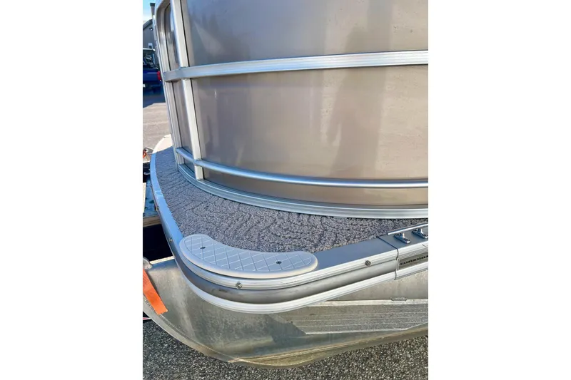 Slide: The Image of Close-up of 2013 South Bay 417 CR boat with textured carpet and metal railing. - 50