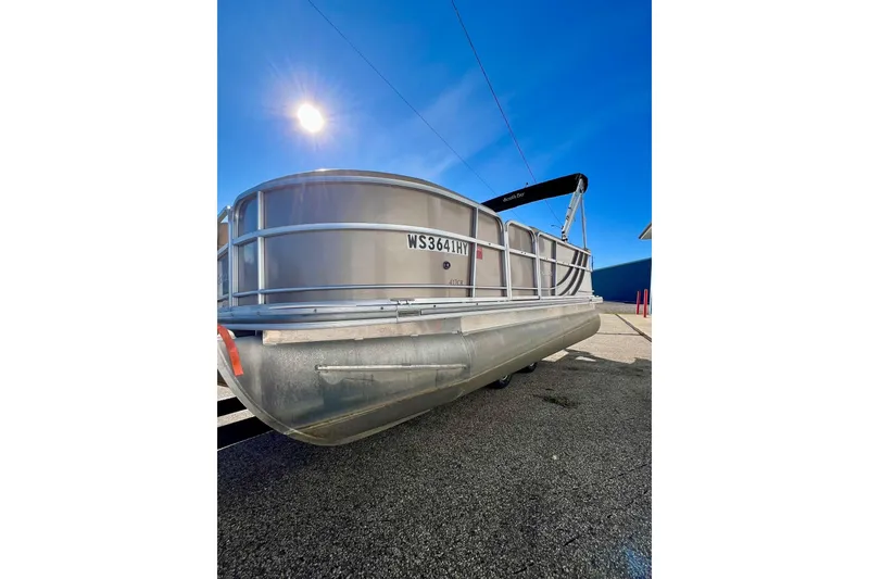 Slide: The Image of 2013 South Bay 417 CR pontoon boat with Mercury outboard motor, docked on a sunny day. - 52