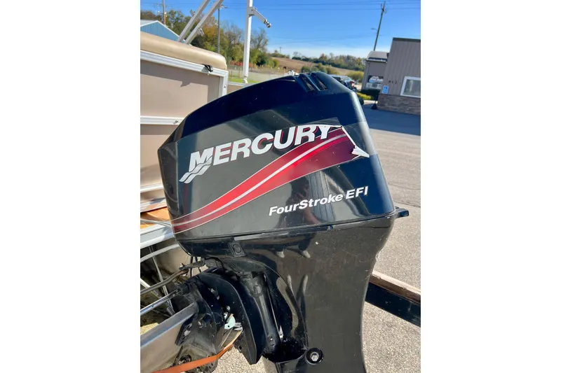 Slide: The Image of 2013 South Bay 417 CR boat with 40 HP outboard motor on trailer. - 7