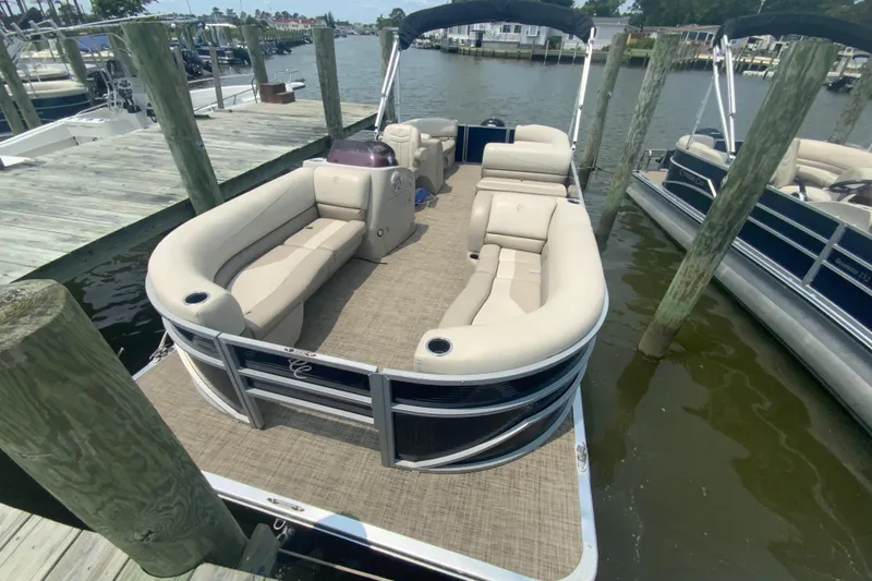 Slide: The Image of 2023 Cypress Cay Seabreeze 232 pontoon boat docked at marina. - 3