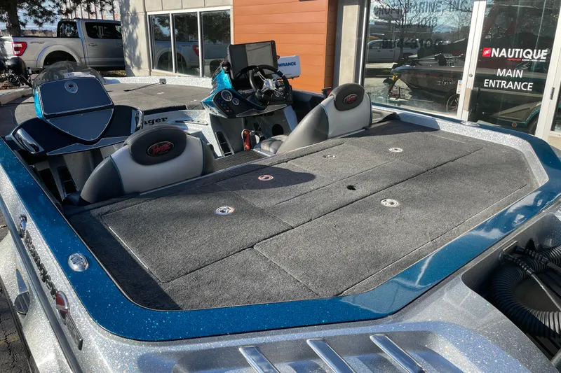 Slide: The Image of 2014 Ranger Z520C Carbon Comanche boat interior with seating and control panel. - 5