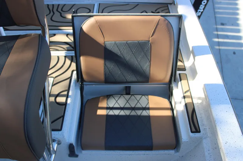Slide: The Image of 2026 Xpress H20B Bay boat seat with brown and black upholstery. - 10