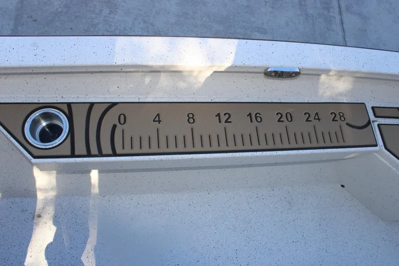 Slide: The Image of Ruler on 2026 Xpress H20B Bay boat deck, measuring up to 28 inches. - 16