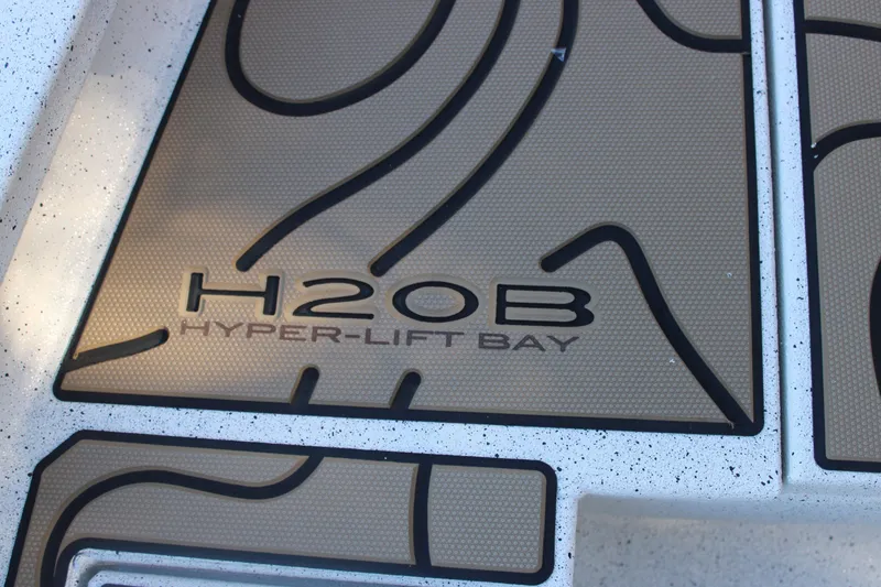 Slide: The Image of 2026 Xpress H20B Bay boat deck with Hyper-Lift Bay logo. - 22