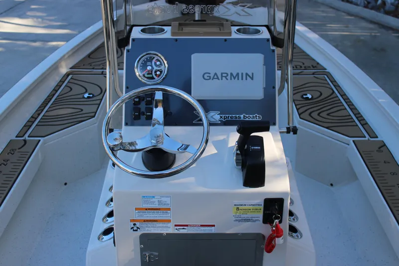 Slide: The Image of 2026 Xpress H20B Bay boat console with Garmin navigation and steering wheel. - 8