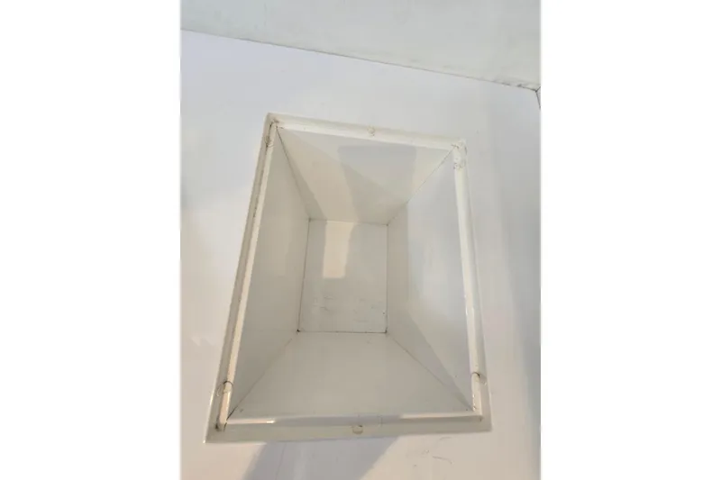 Slide: The Image of White Giorgi 46 model box, 1993, viewed from above on a white surface. - 106