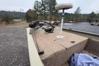 Slide: The Image of 2007 Alumacraft 1756 All Weld MV CC boat with trolling motor in a scenic outdoor setting. - 4