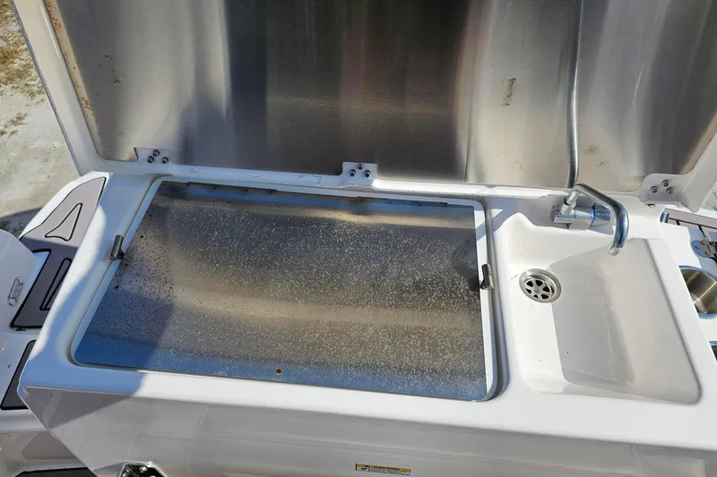 Slide: The Image of 2024 Cutwater C-248 Coupe boat sink and countertop, featuring stainless steel finish. - 10
