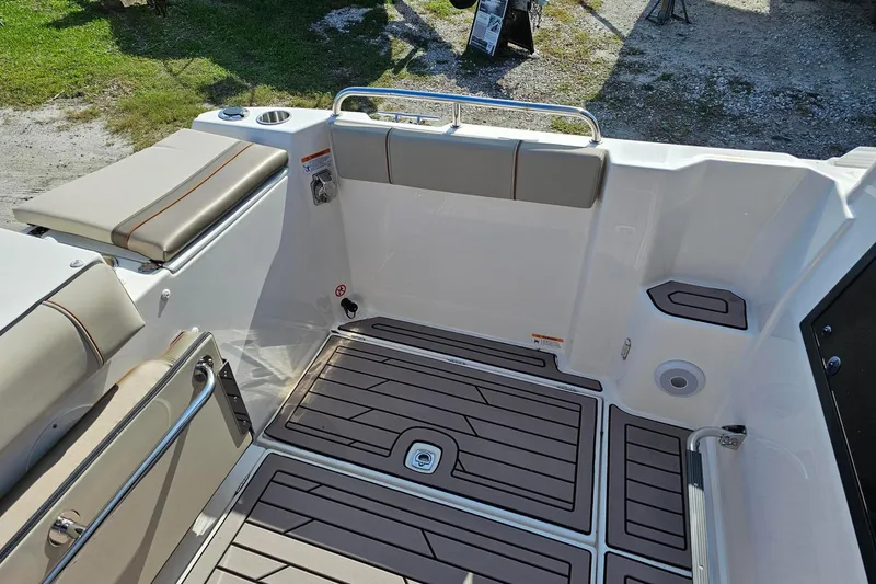 Slide: The Image of 2024 Cutwater C-248 Coupe boat interior with cushioned seating and non-slip flooring. - 12