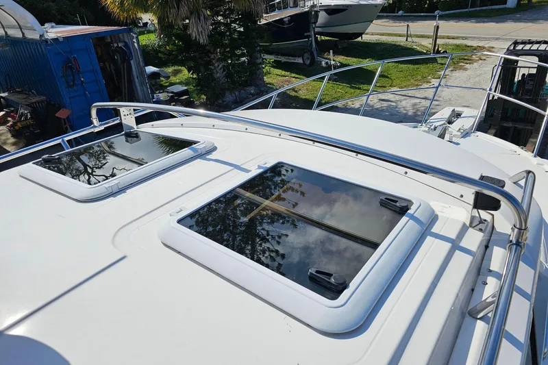 Slide: The Image of 2024 Cutwater C-248 Coupe boat deck with dual skylights and railing. - 13