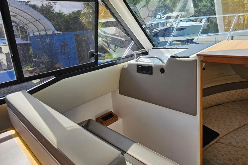 Slide: The Image of 2024 Cutwater C-248 Coupe interior with seating and window view. - 21