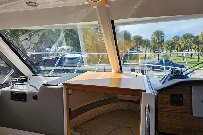 Slide: The Image of 2024 Cutwater C-248 Coupe interior view with dashboard and scenic window. - 22