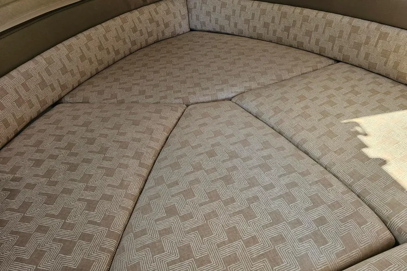 Slide: The Image of 2024 Cutwater C-248 Coupe interior with patterned upholstery, showcasing comfortable seating. - 33