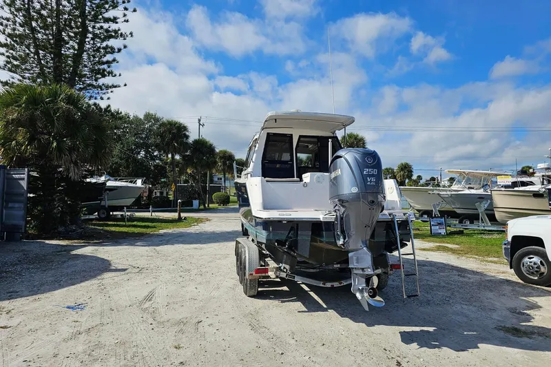 Slide: The Image of 2024 Cutwater C-248 Coupe boat with Yamaha engine in a sunny outdoor setting. - 4