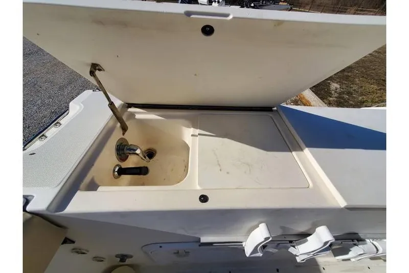 Slide: The Image of Open storage compartment on a 1997 Pursuit 2800 Offshore boat. - 12