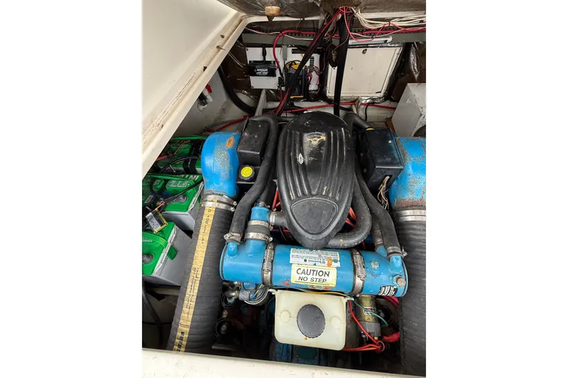 Slide: The Image of Engine compartment of a 1997 Pursuit 2800 Offshore boat, featuring wiring and components. - 15