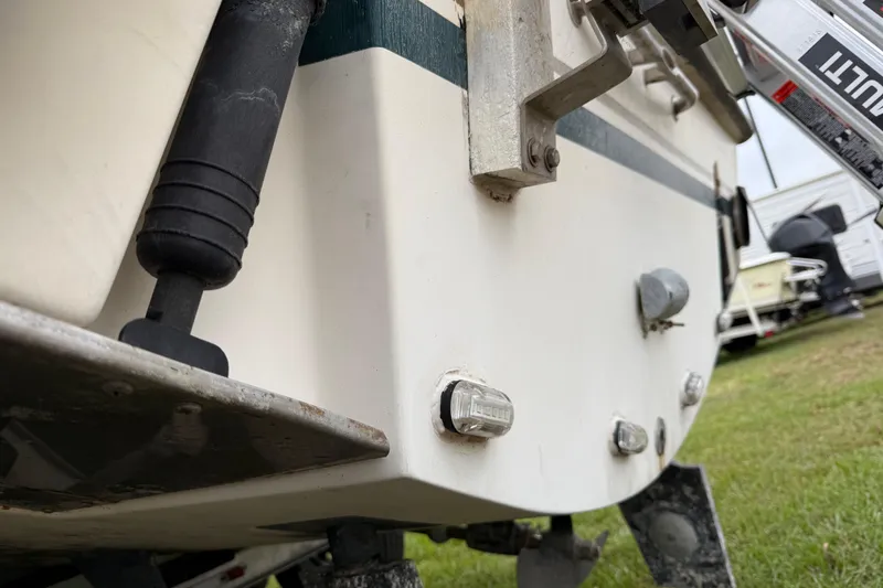 Slide: The Image of 1997 Pursuit 2800 Offshore boat stern detail with hardware and fittings. - 8