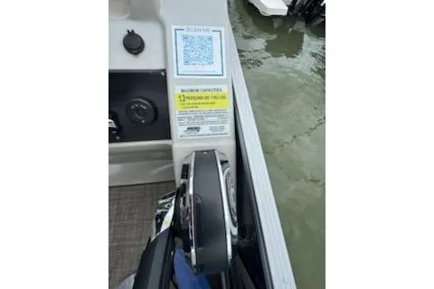 Slide: The Image of 2023 Cypress Cay Seabreeze 232 boat dashboard with QR code and safety instructions. - 11