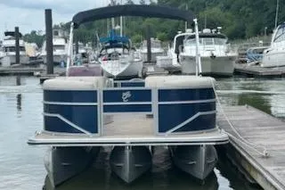 Slide: The Image of 2023 Cypress Cay Seabreeze 232 pontoon boat docked at marina. - 2