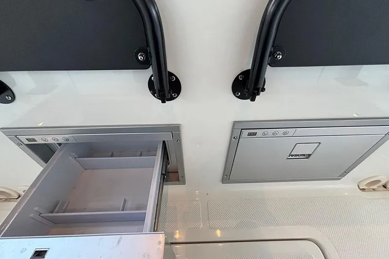 Slide: The Image of 2026 Navan S30 interior storage compartments with open and closed drawers. - 10