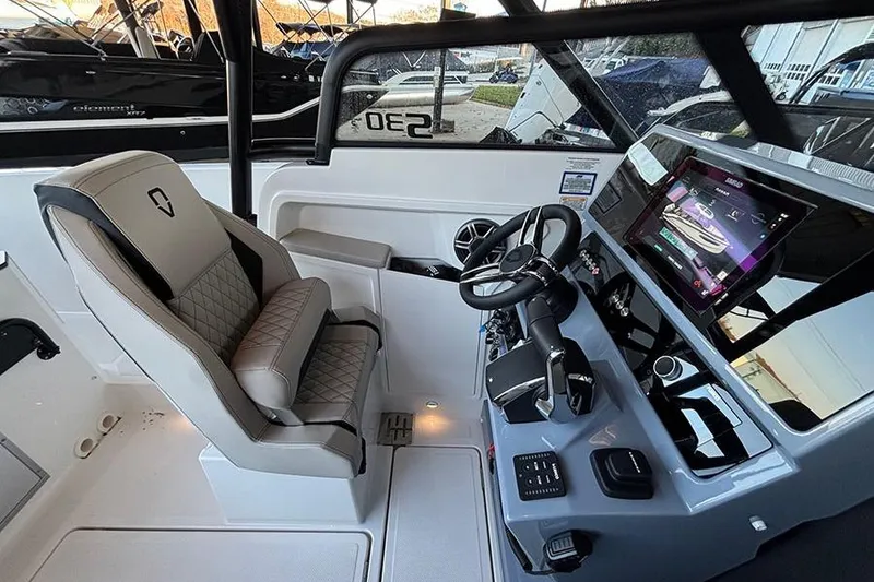 Slide: The Image of 2026 Navan S30 boat cockpit with modern steering, touchscreen display, and luxurious seating. - 14