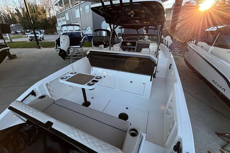 Slide: The Image of 2026 Navan S30 boat interior with seating, table, and modern design in a marina setting. - 6