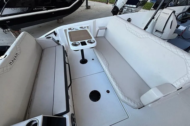 Slide: The Image of 2026 Navan S30 boat interior with white seating and a central table. - 7