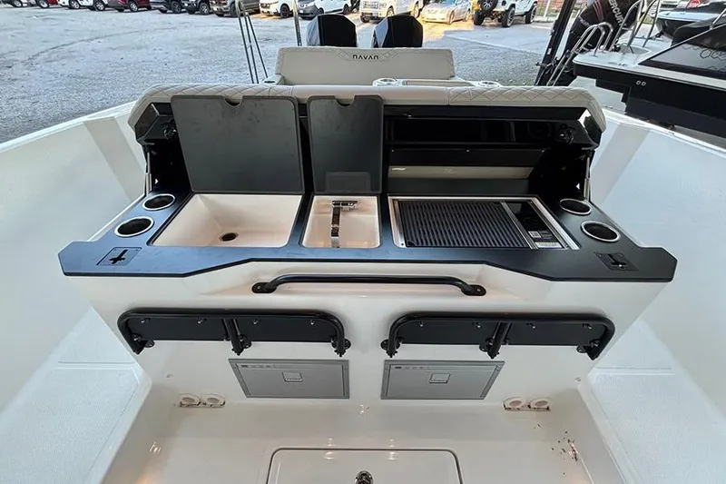 Slide: The Image of Navan S30 2026 boat interior with sink, grill, and storage compartments. - 9