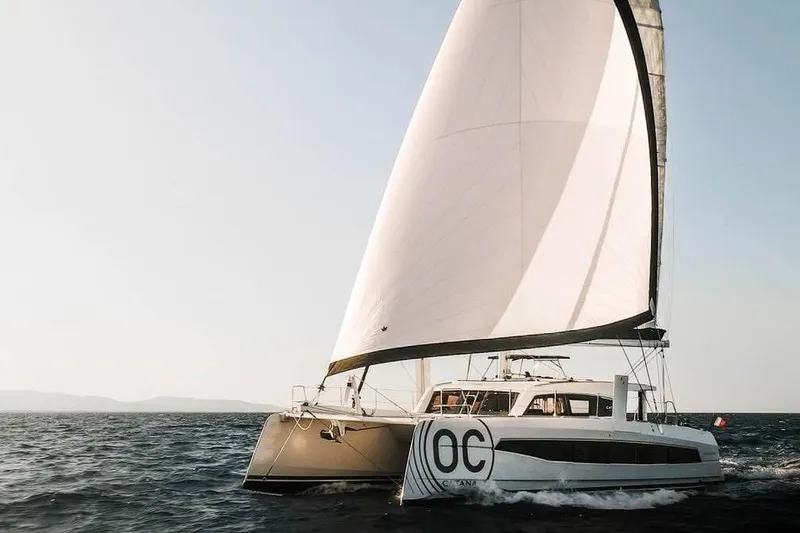 The Image of 2026 Catana OC2 catamaran sailing on open sea with full sails. - 0