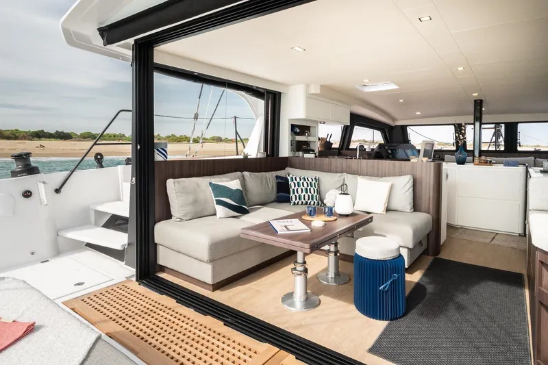 Slide: The Image of Luxurious interior of 2026 Catana OC2 catamaran with modern seating and elegant decor. - 11