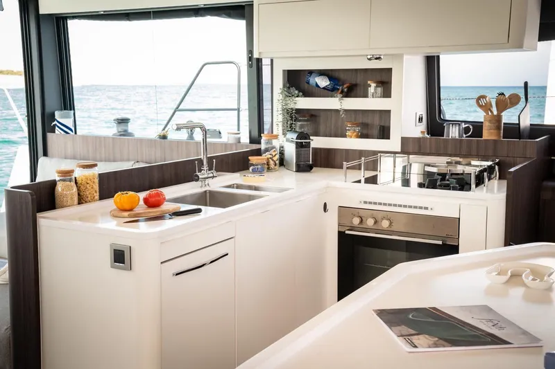 Slide: The Image of Modern kitchen interior on 2026 Catana OC2 yacht with ocean view. - 12