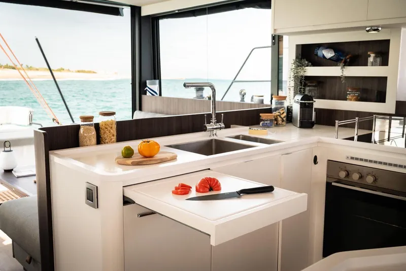 Slide: The Image of Modern kitchen interior on 2026 Catana OC2 yacht with ocean view. - 13