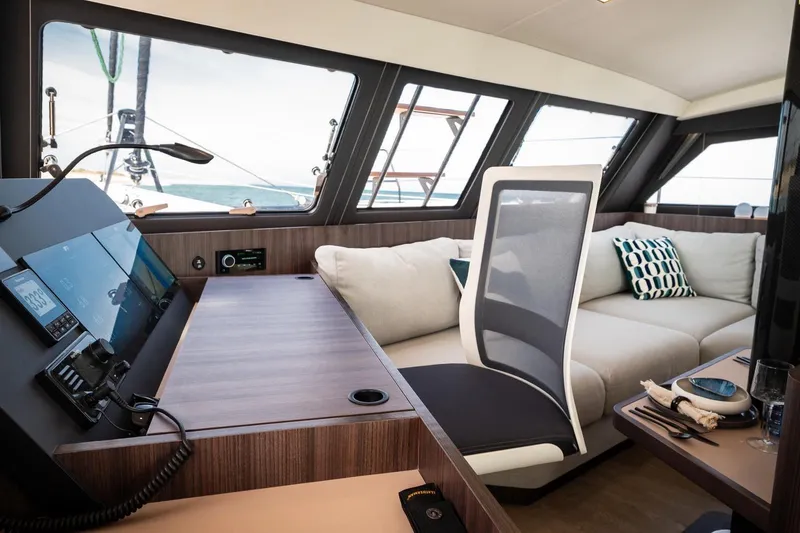 Slide: The Image of Luxurious interior of 2026 Catana OC2 yacht with modern seating and navigation controls. - 19