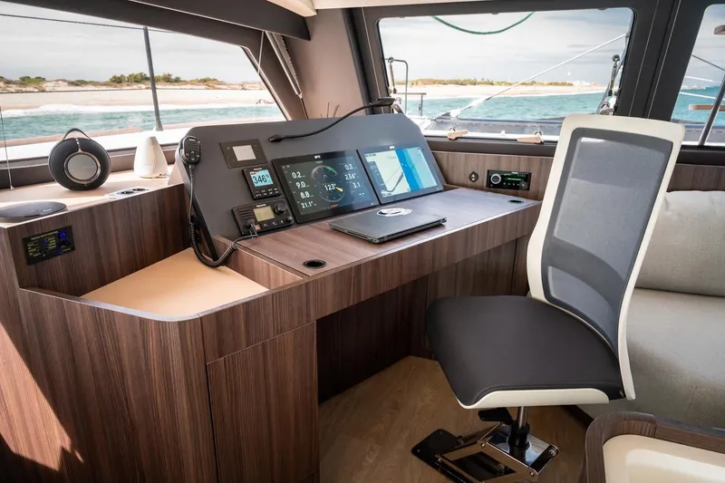 Slide: The Image of Modern Catana OC2 2026 yacht cockpit with navigation screens and ergonomic chair. - 20