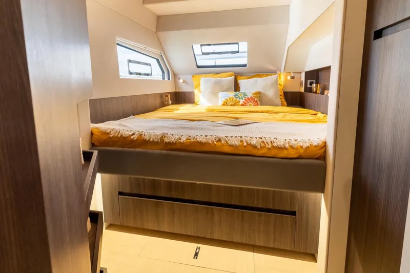 Slide: The Image of Luxurious Catana OC2 2026 yacht cabin with cozy bed and modern design. - 21