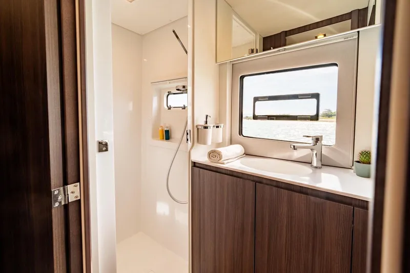 Slide: The Image of Luxurious bathroom in 2026 Catana OC2 yacht with modern fixtures and ocean view. - 26