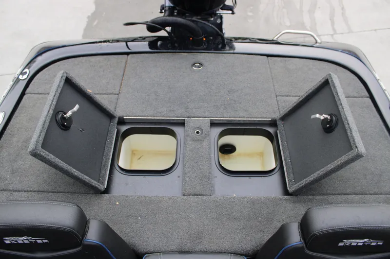 Slide: The Image of 2022 Skeeter ZX225 boat deck with open storage compartments. - 10