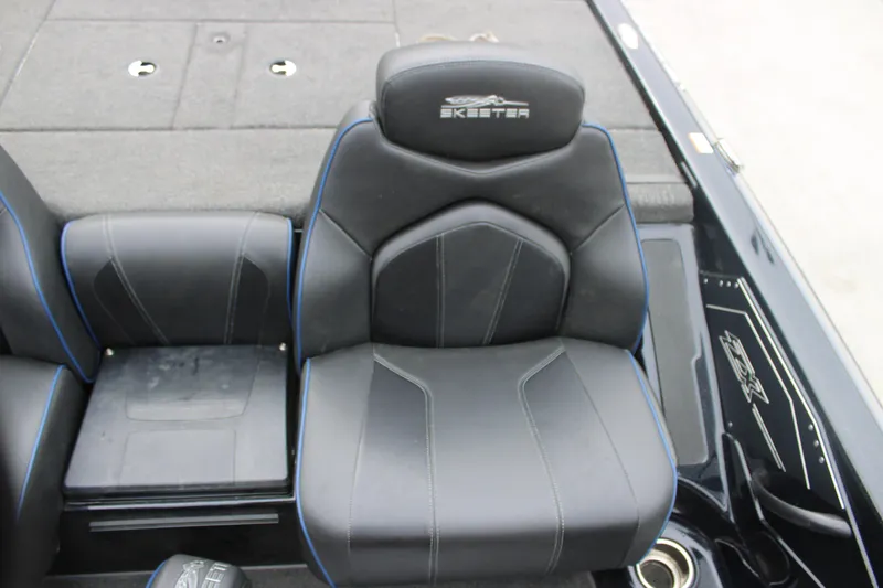 Slide: The Image of 2022 Skeeter ZX225 boat seat with black upholstery and blue accents. - 18
