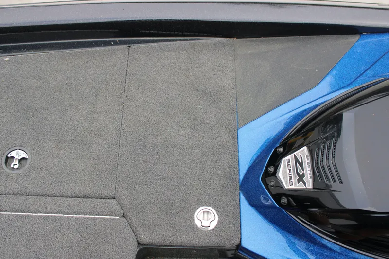 Slide: The Image of 2022 Skeeter ZX225 boat deck with blue accents and ZX Series emblem. - 20