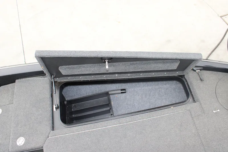Slide: The Image of Open storage compartment on 2022 Skeeter ZX225 boat deck. - 23
