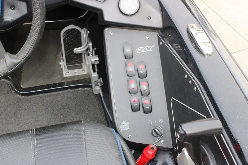 Slide: The Image of 2022 Skeeter ZX225 boat dashboard with control panel and foot pedal. - 27