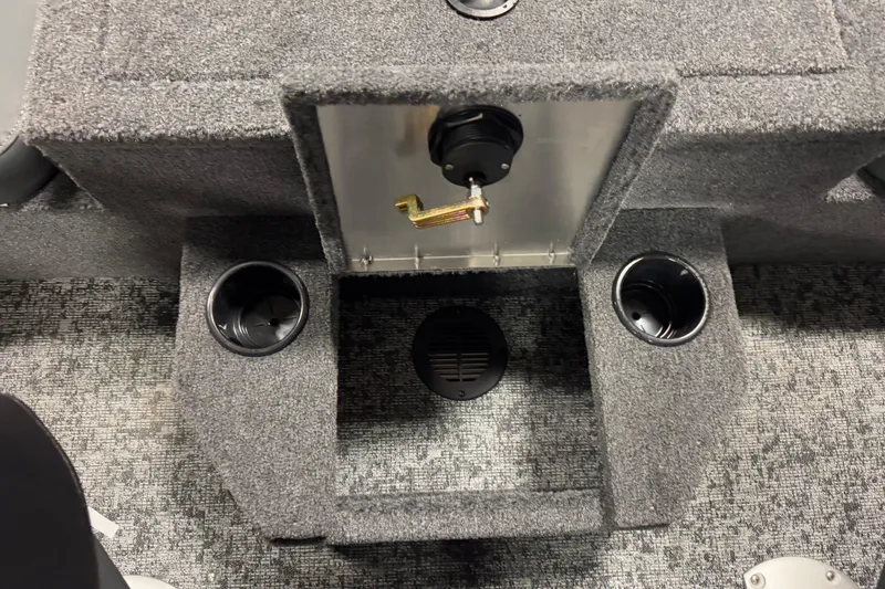 Slide: The Image of Interior of 2026 Tracker Targa V-18 Combo boat with cup holders and storage compartment. - 18