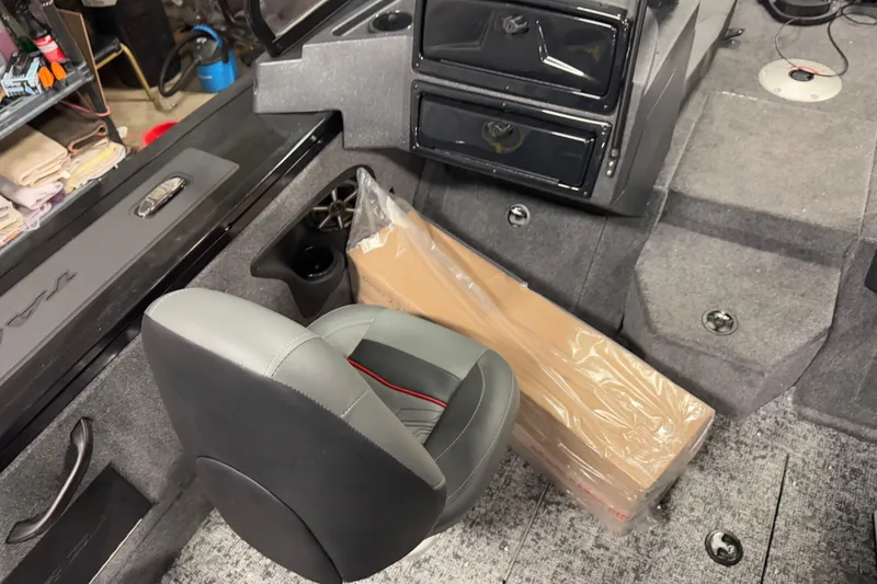 Slide: The Image of Interior of 2026 Tracker Targa V-18 Combo boat with seating and storage compartments. - 19