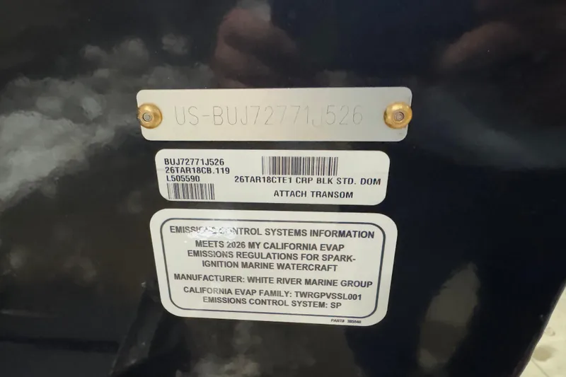 Slide: The Image of 2026 Tracker Targa V-18 Combo emission control and identification labels on transom. - 6