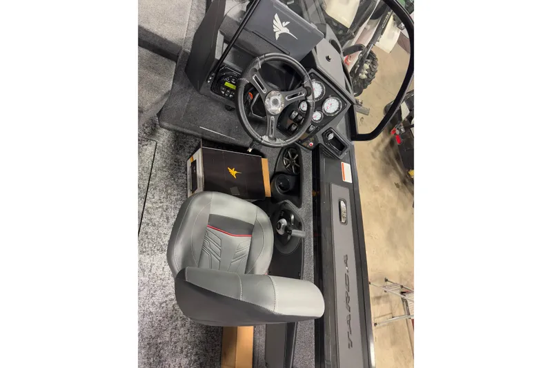 Slide: The Image of 2026 Tracker Targa V-18 Combo boat interior with steering wheel and dashboard controls. - 7