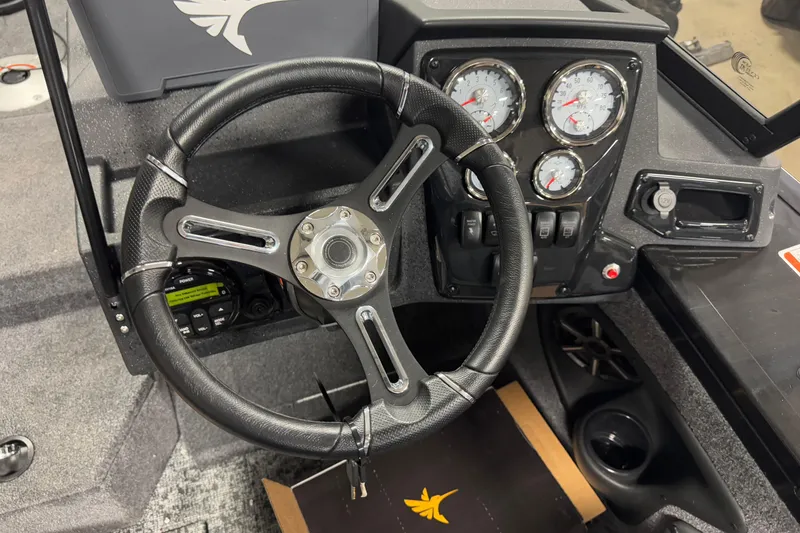 Slide: The Image of Steering wheel and dashboard of 2026 Tracker Targa V-18 Combo boat. - 9
