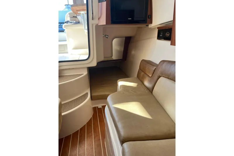 Slide: The Image of Interior of 2015 Grady-White Freedom 375 boat with seating and TV. - 14