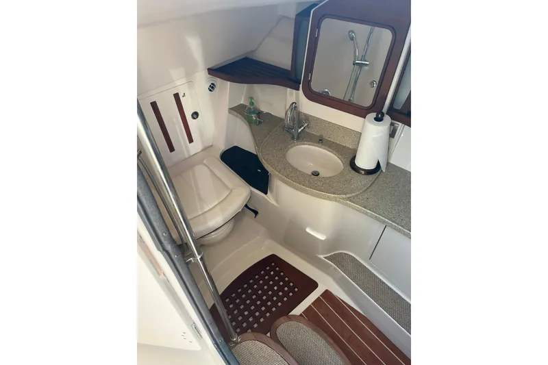 Slide: The Image of 2015 Grady-White Freedom 375 boat bathroom with sink, toilet, and mirror. - 15